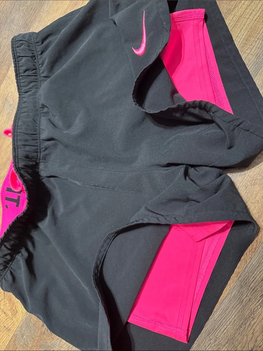 Nike Black Women's Athletic Shorts with Pink Swoosh